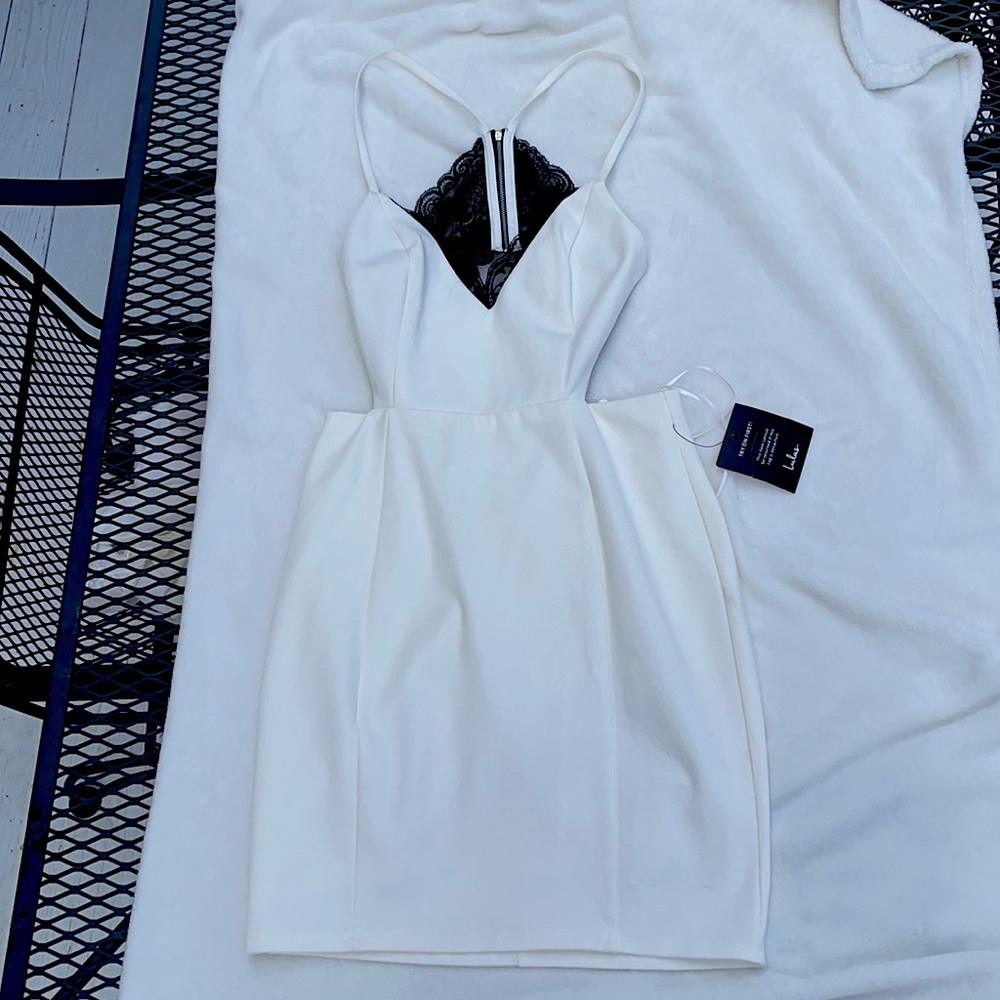 Lulus size small bodycon white dress with black lace.